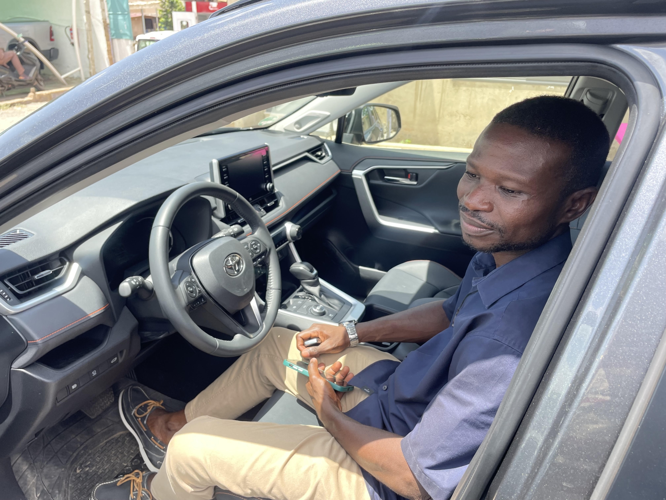 man in car