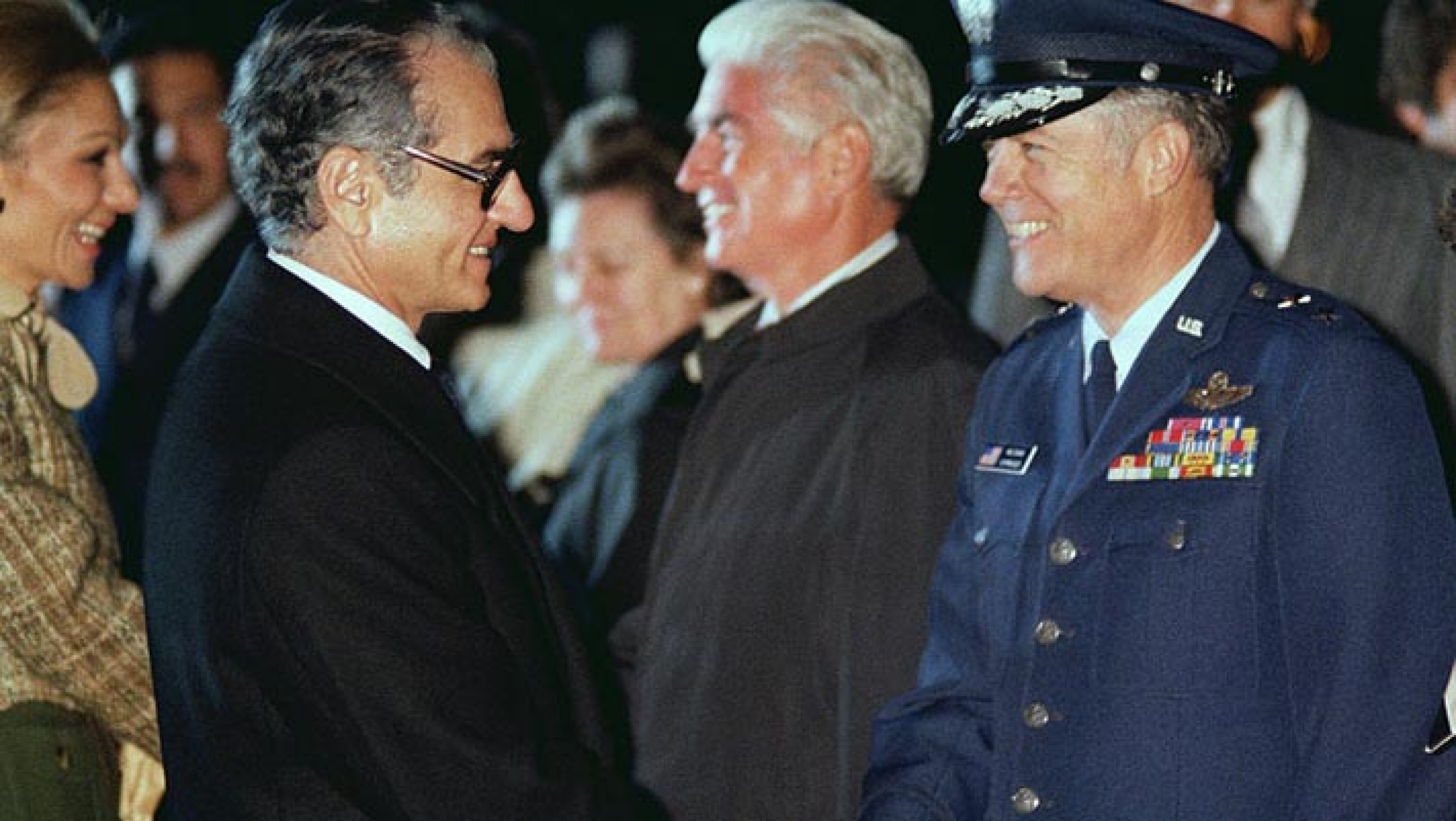 Mohammed Reza Pahlavi, Shah of Iran, shakes hands with a US Air Force general officer prior to his departure from the United States. Mohammed Reza Pahlavi, Shah of Iran, shakes hands with a US Air Force general officer prior to his departure from the United States.