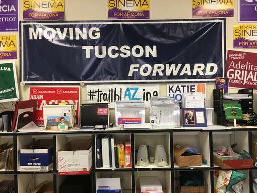 Shelf with various campaign items, posters