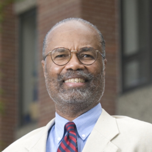 A man poses in a headshot photo