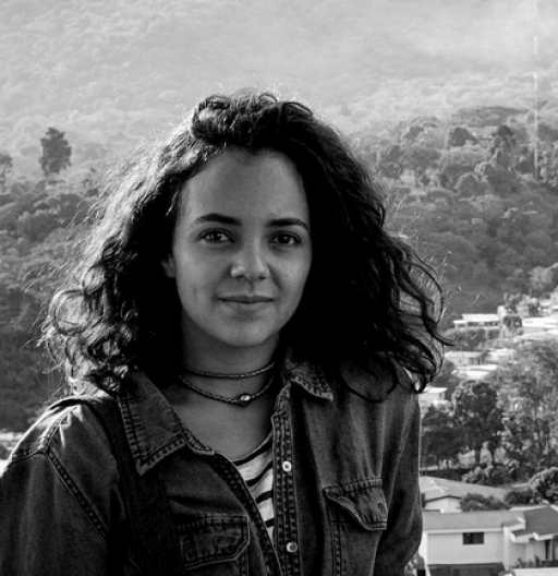 Cristina Baussan is a documentary photographer and writer based in New York City. Cristina Baussan is shown in a portrait photograph in black and white.
