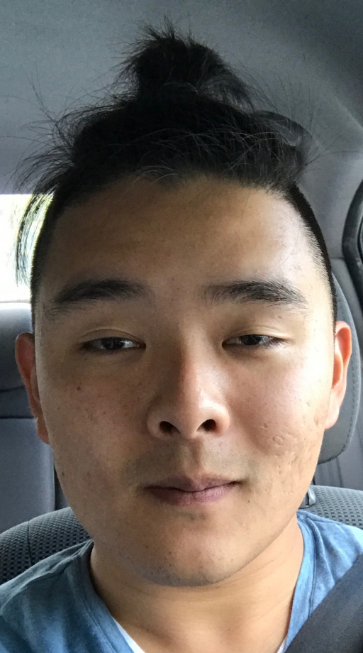 close portrait of man looking at camera