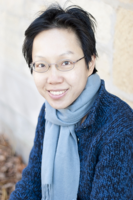 Woman in scarf smiling at camera