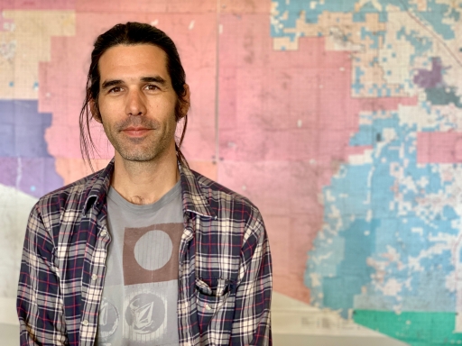 Scott Warren, charged with harboring two undocumented migrants, poses in this photo taken in Ajo, Arizona, on April 12, 2019. A man poses for a photograph