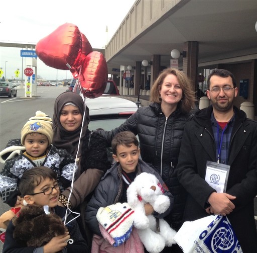 A Syrian refugee family poses in front of the airport after being resettled to Ohio. A Syrian refugee family poses in front of the airport after being resettled to Ohio.