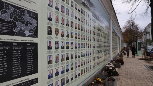 Circumscribing the St. Michael's monastary grounds in Kyiv, Ukraine, is a wall of photos. Each portrait commemorates a Ukrainian soldier killed in the war in Donbas, a war fueled by Russian aggression against Ukraine. Circumscribing the St. Michael's monastery grounds in Kyiv, Ukraine, is a wall of portraits of soldiers.