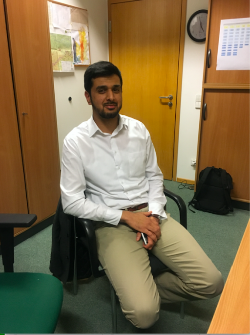 Imam Umer Malik said there is an issue with Nazis in the region and some people think nothing of being openly racist on the streets. A man wearing white shirt and tan slacks sits at his desk in an office
