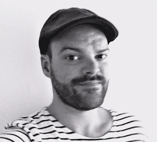 A black and white portrait of reporter Steven Grattan