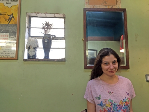Ana Oppenheim A girl poses for a mid-shot in front of a window