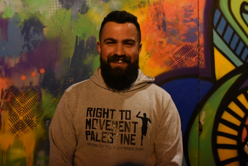 Mahmoud Lafi, a 27-year-old Palestinian who helps organize the Right to Movement runs. A portrait of Mahmoud Lafi, leader of Right to Movement, wears a grey sweatshirt
