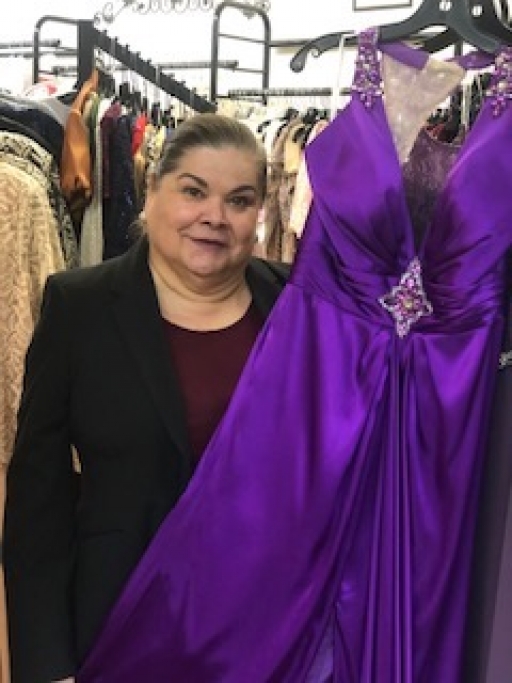Ida Ann Pedregó poses with a dress at her boutique in Douglas, Arizona. Ida Ann Pedregó poses with a dress at her boutique in Douglas, Arizona. She closed the store indefinitely March 21 due to the coronavirus outbreak.