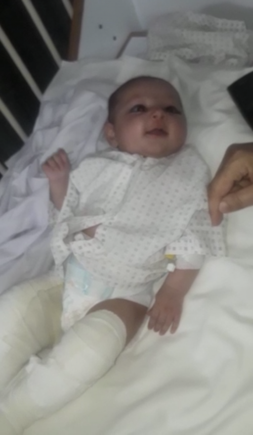 Ameneh Sharifi, her legs in bandages, smiles in a family video as she recovers. Ameneh Sharifi, her legs in bandages, smiles in a family video as she recovers.