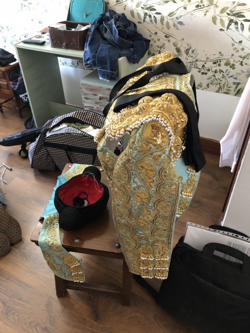 Leandro Gutierrez’s ornate bullfighting outfit draped on a chair. Leandro Gutierrez’s ornate bullfighting outfit draped on a chair.