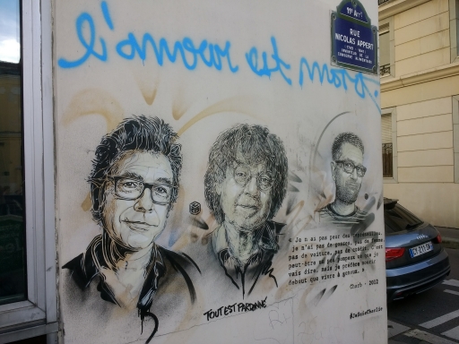 A mural depicts several of the Charlie Hebdo journalists who lost their lives in the attacks on their offices in Paris in January 2015. Photo taken in 2017 on Rue Nicolas-Appert, near the former office. A mural depicts several of the Charlie Hebdo journalists who lost their lives in the attacks on their offices in Paris in January 2015.