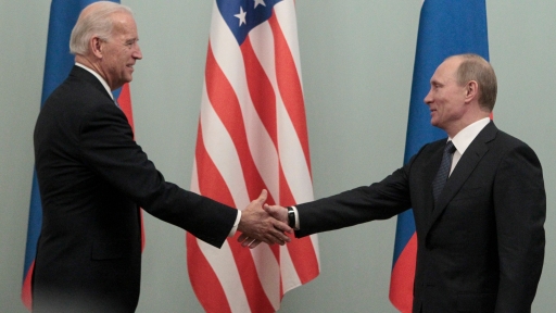 Then-Prime Minister Vladimir Putin shakes hands with Biden on the second day of his official visit to meet with top officials in the Russian capital in Moscow, March 10, 2011.