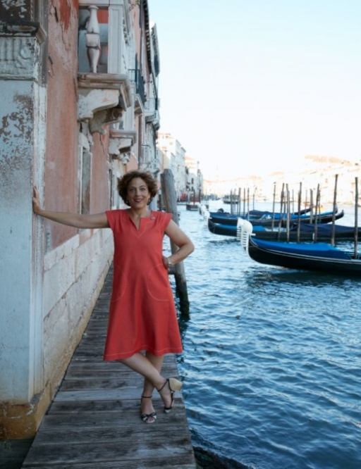 Jane Da Mosto, seen on the edge of a Venetian canal, is not complaining about the lower number of tourists visiting her hometown these days.