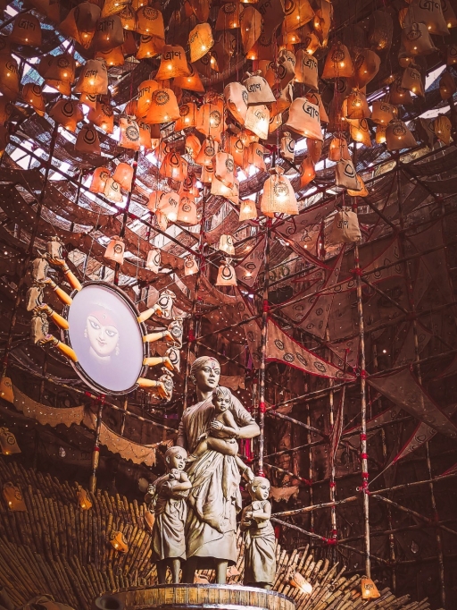 The tragedy of migrants families during the pandemic lockdown finds expression in a Durga Puja, Kolkata, India, 2020. A statue of a migrant woman made of simple clay as Durga goddess.