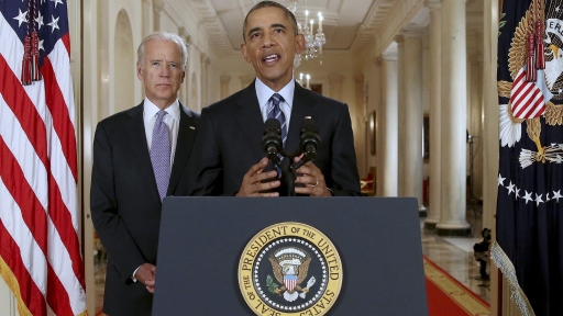 Former US President Barack Obama delivers a statement after a nuclear deal was reached between Iran and six major world powers, beside former Vice President Joe Biden, in the East Room of the White House in Washington, July 14, 2015.