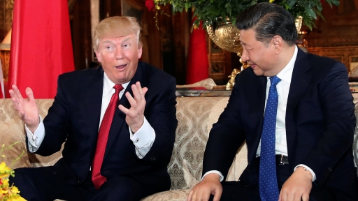 US President Donald Trump talks with Chinese President Xi Jinping at the start of their summit at Mar-a-Lago estate in West Palm Beach, Florida, April 6, 2017. US President Donald Trump throws his hands in the air as he talks with Chinese President Xi Jinping