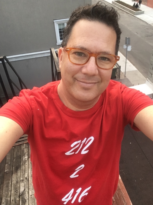 Stephen Shainbart, who left New York for Toronto, wears a shirt with the area codes of his previous and current cities. Stephen Shainbart, who left New York for Toronto after Trump took office, wears a shirt with the area codes of his previous and current cities.