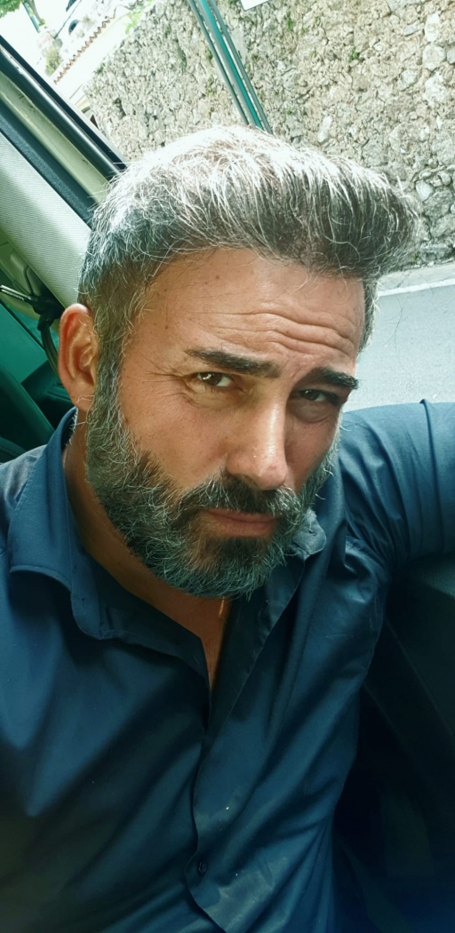 Naples taxi driver Ciro la Motta. Naples taxi driver Ciro la Motta, with salt-and-pepper beard.