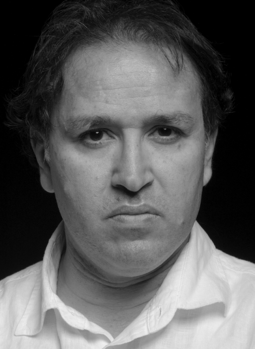 Black and white portait of Khaled Mattawa, a Libyan American poet. 