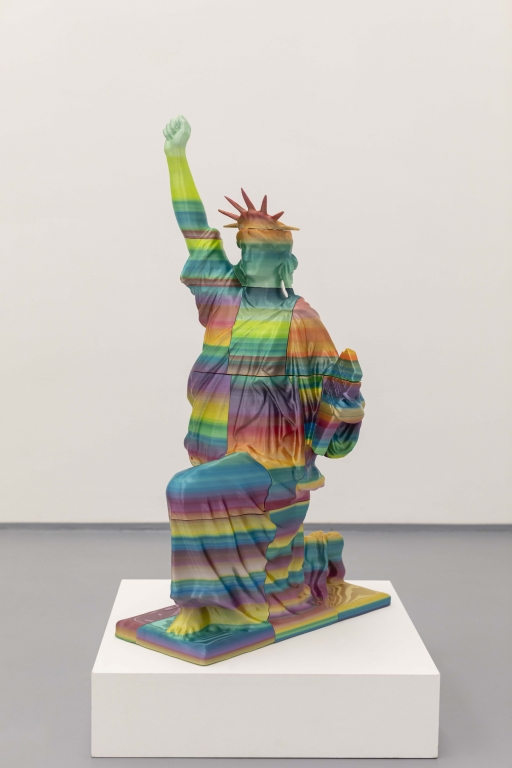 A miniature sculpture of Lady Liberty holding a tablet that reads "Black Lives Matter." A miniature sculpture of Lady Liberty holding a tablet that reads "Black Lives Matter."