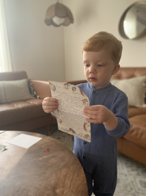Edison’s mom says her son isn’t fully aware of all that “Fridays with Edison” has become. But he knows he has “friends in Toronto,” and he loves getting mail from them. A toddler holds a letter in his hands and reads it