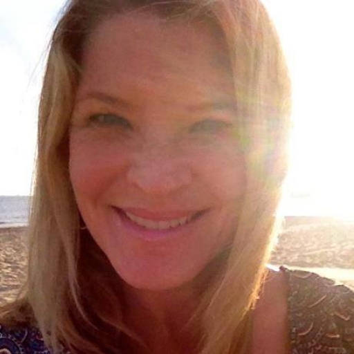 Woman in bright sunlight, smiling