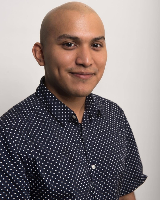 Portrait of man, smiling at camera