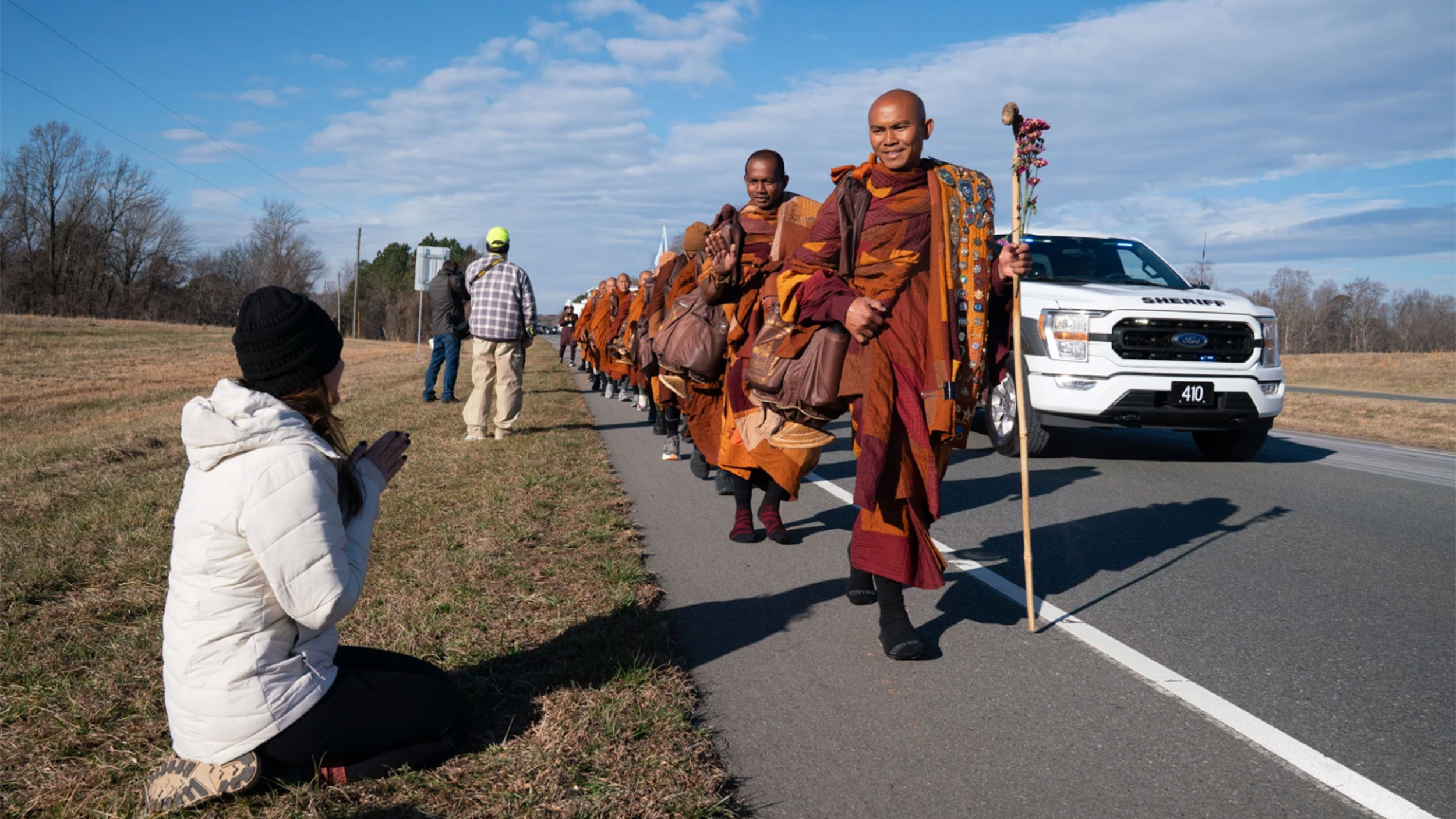 Buddhist monks on national Walk for Peace receive flowers, tears, and gratitude along a NC highway